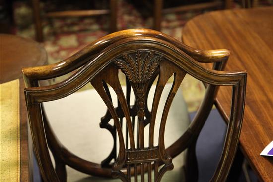 A set of ten late 19th century Hepplewhite style mahogany dining chairs,